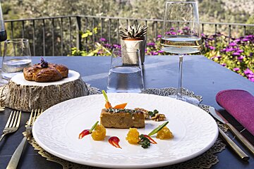 A plate of food and a glass of water on a table