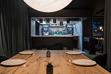 Looking into the kitchen from dining room at Alpage restaurant Courchevel
