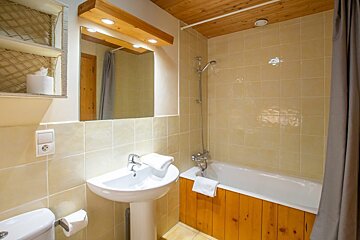 A bathroom with a sink and a bathtub