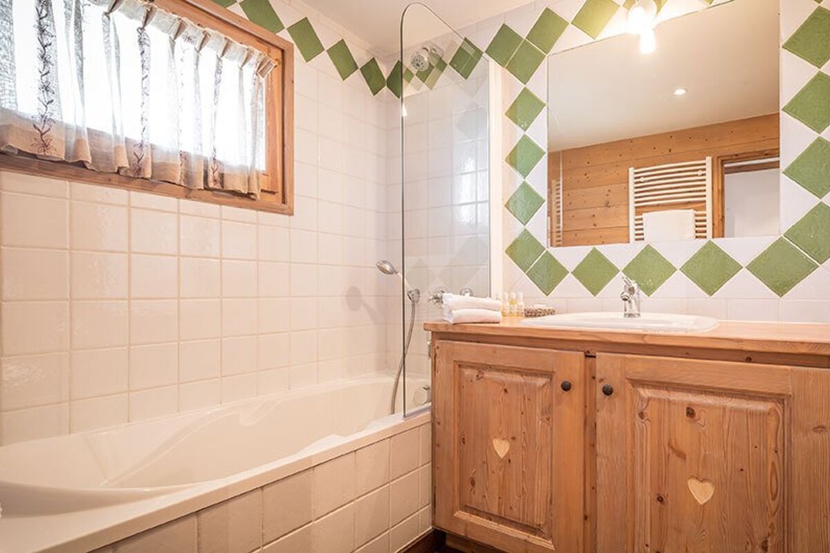 A bathroom with a bathtub and a sink