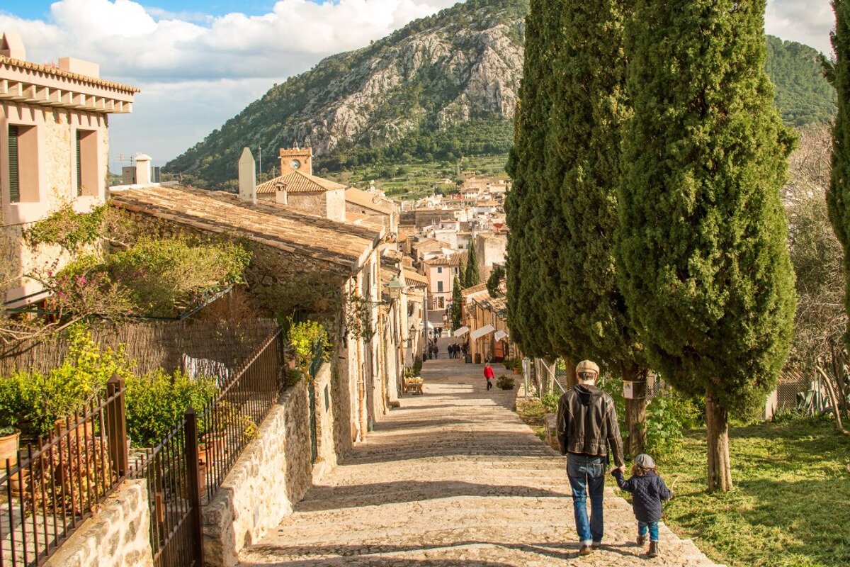 father & son walking in Pollenca