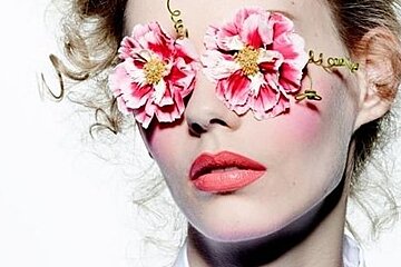 a fashion model with flowers in her eyes