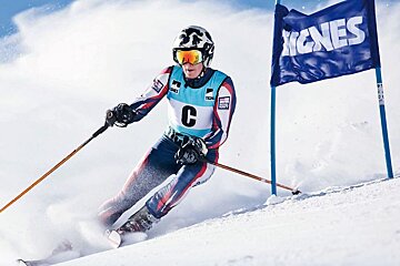 A skier with the letter c on his chest