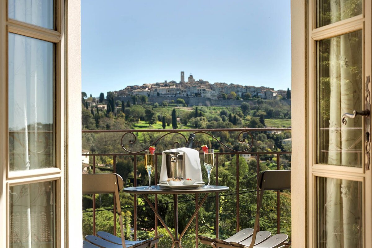 A balcony with a view of a small town