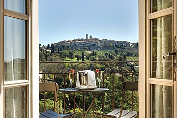 A balcony with a view of a small town
