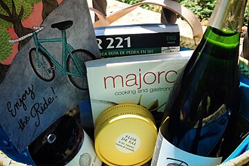 a gift hamper with mallorcan produce and a bike book
