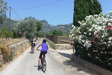 two cyclists on a route in central mallorca