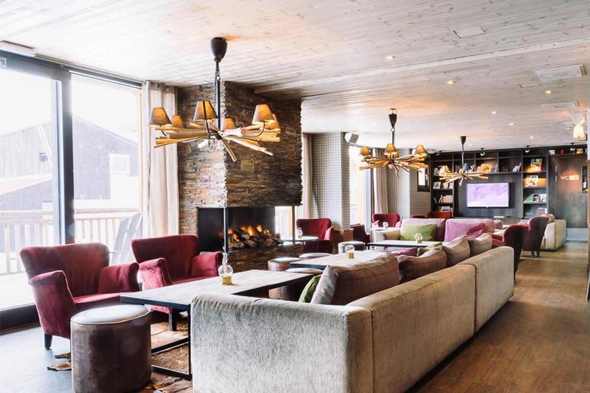 A living room with lots of furniture and a fireplace