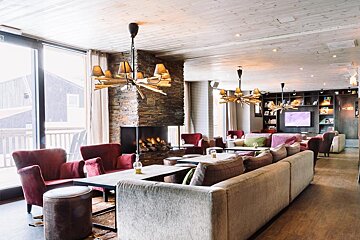 A living room with lots of furniture and a fireplace