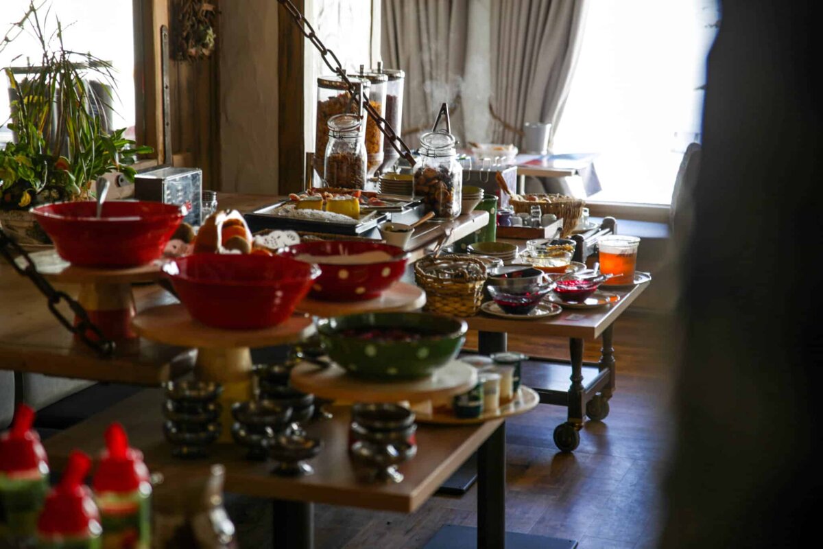 A table with a lot of bowls and jars on it