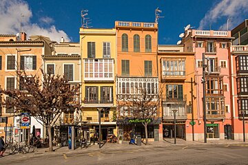 a row of colourful shops in palma