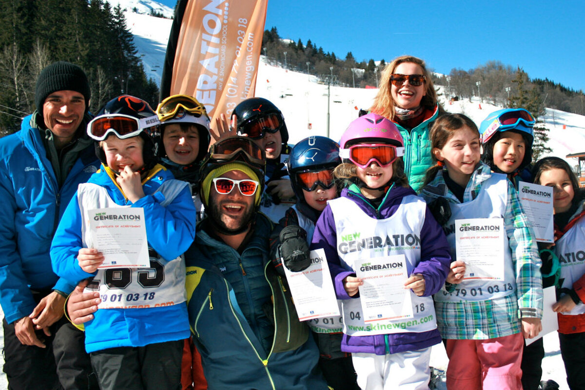 a group of kids holding ski certificates
