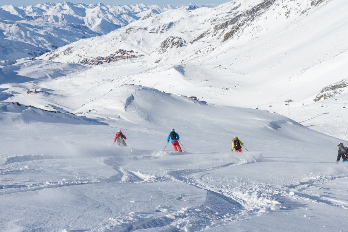 four off piste skiers