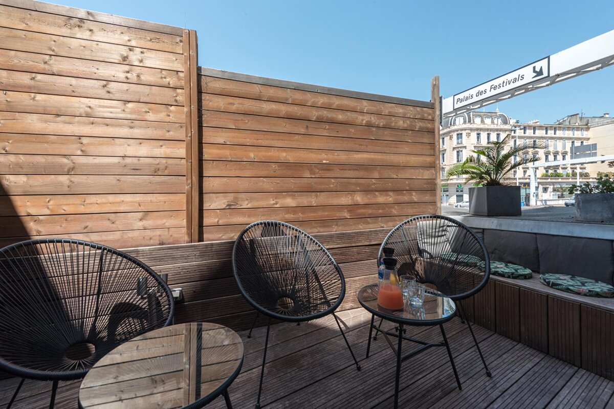 A wooden fence with a sign that says palais des festivals