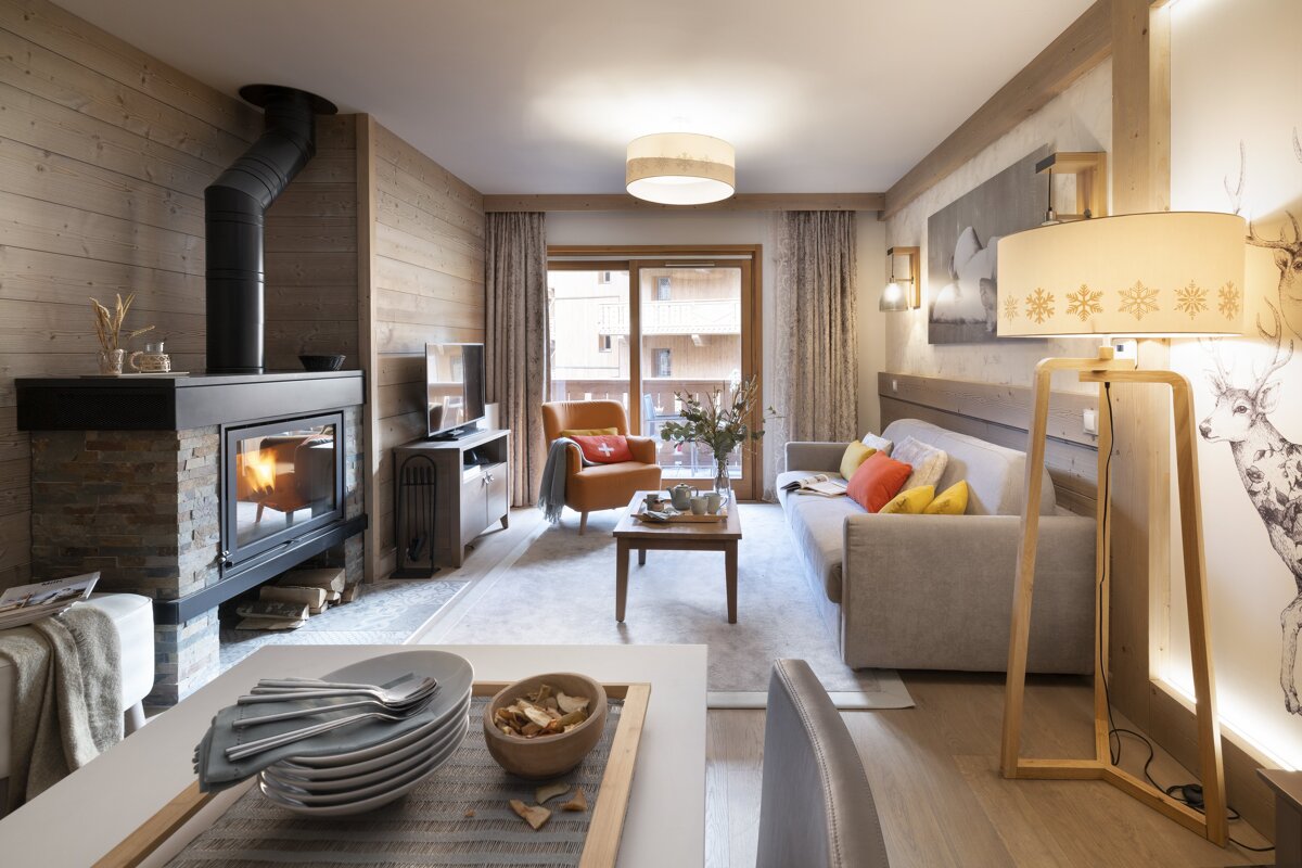 A living room with a fireplace and a couch