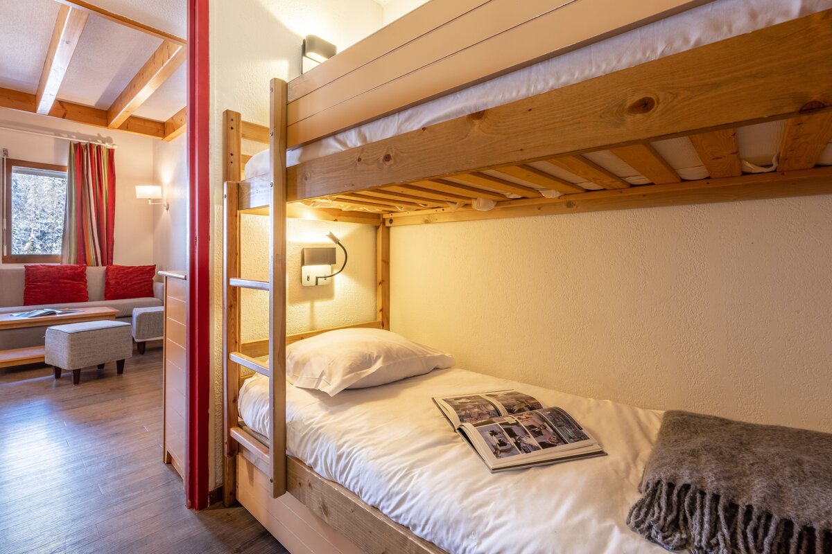 A bunk bed with a book on top of it