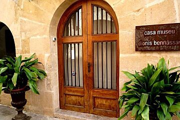 an arched doorway - the entrance to a museum in majorca