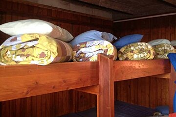 Bunks and blankets in the refuge