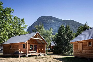 Wooden chalet at Huttopia in summer
