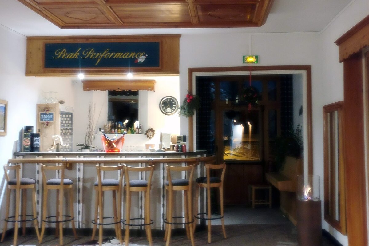 A bar with a sign above it that says peak performance