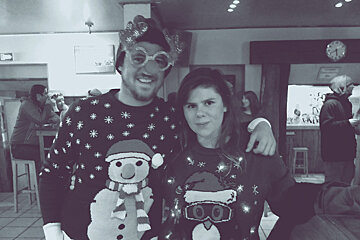 two people in xmas jumpers in loop bar