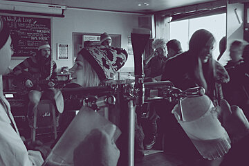 pints being poured behind the bar at Loop Bar