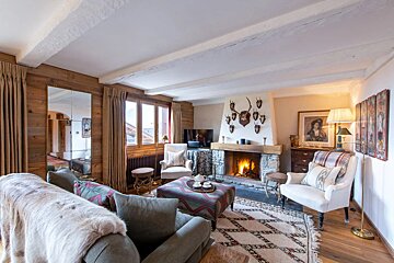 A living room with a fireplace and a couch