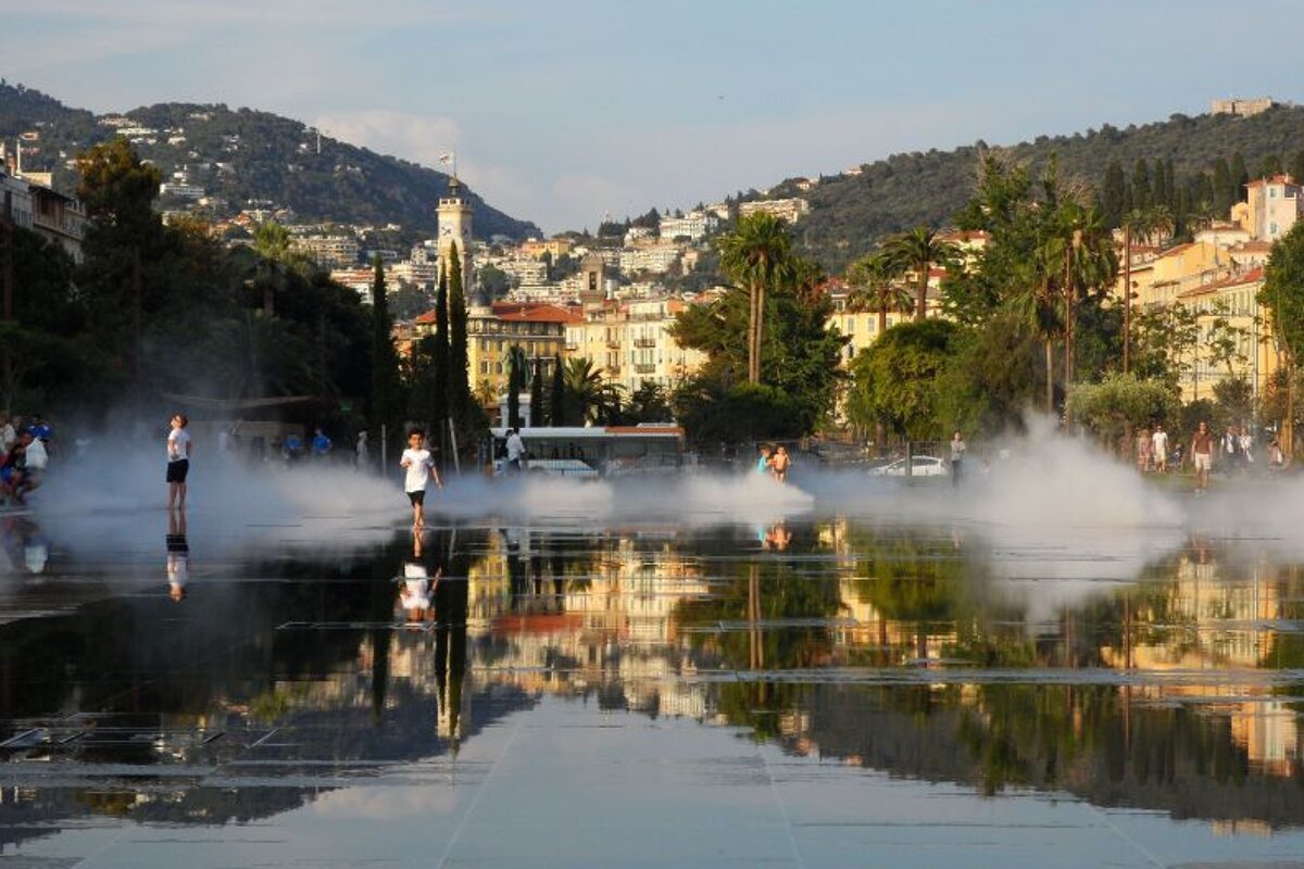 children playing in a fountain in Nice