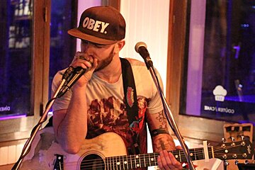 a musician singing in a bar