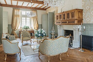 A living room filled with furniture and a fireplace
