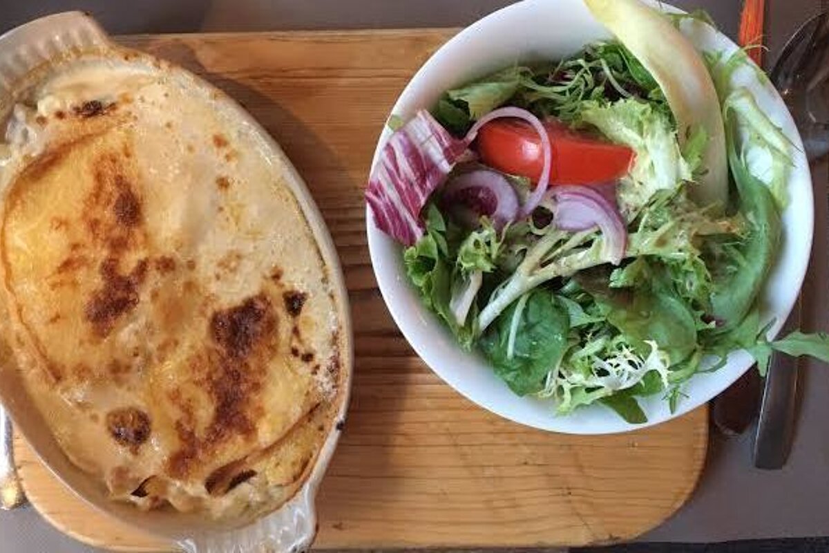 an oven dish filled with tartiflette