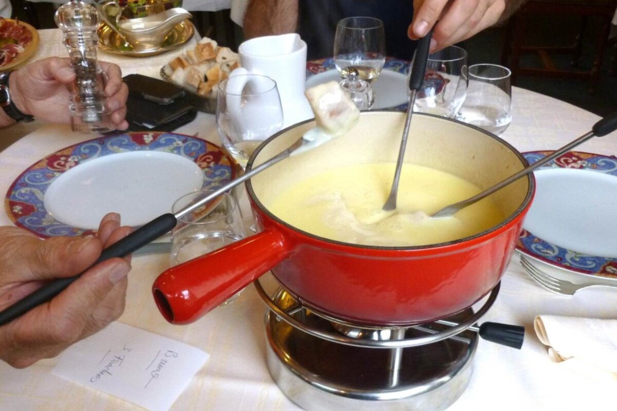 fondue being shared by 3 people