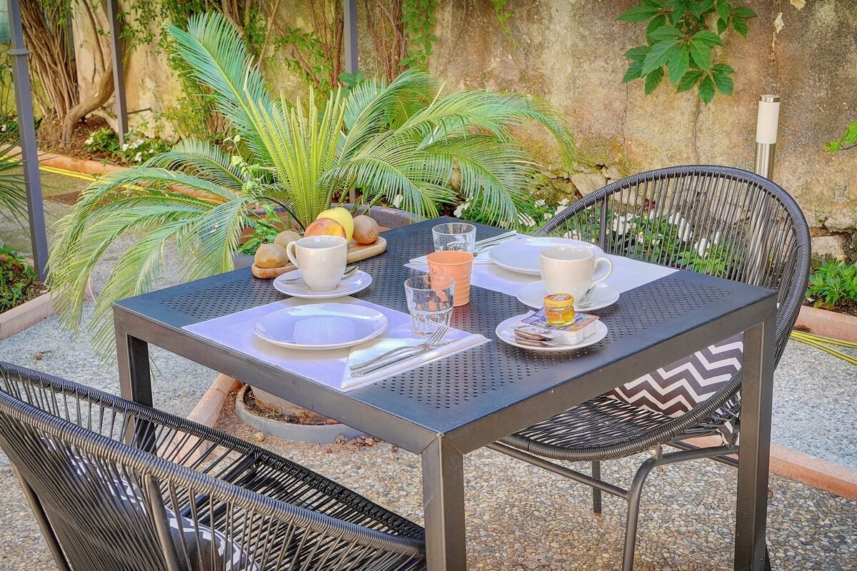 A table with plates glasses and cups on it