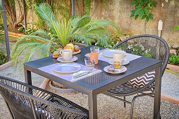 A table with plates glasses and cups on it