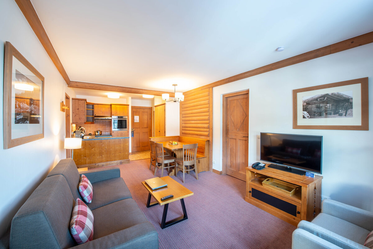 A living room with a couch and a flat screen tv