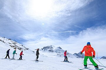 a ski instructor giving a group lesson