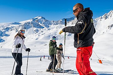 a ski instructor giving a group lesson