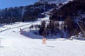 the bottom of a piste with speed control markers