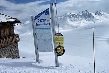 a sign on the glacier warning about avalanches