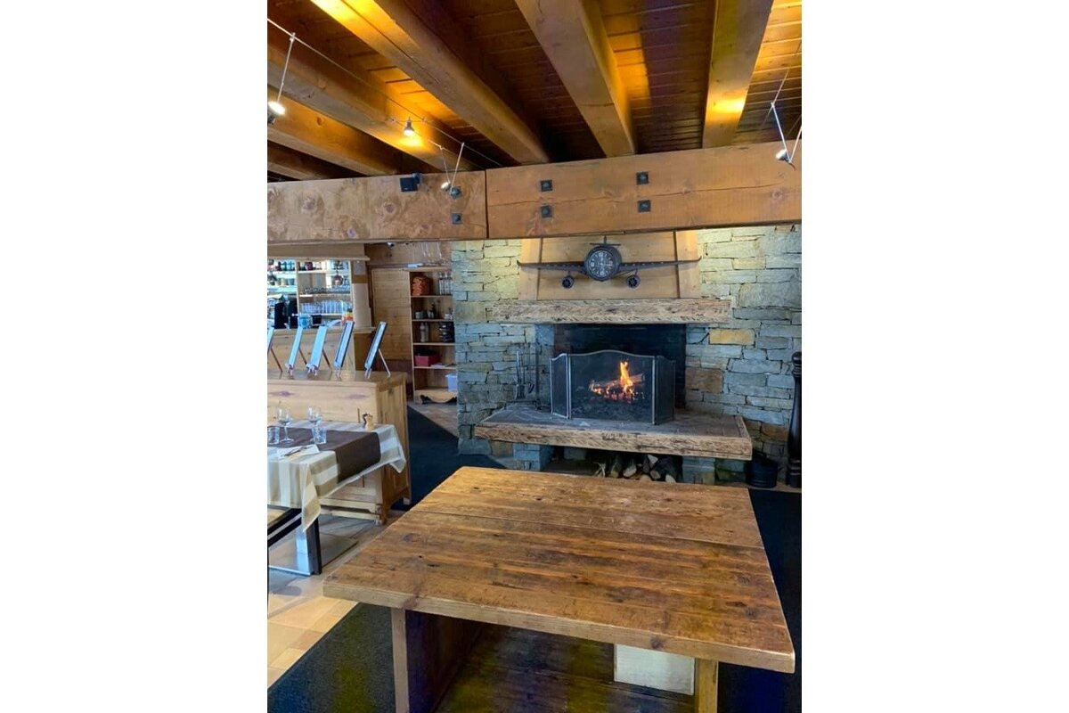 A fireplace with a wooden table in front of it