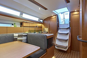 A boat has a staircase leading up to the deck