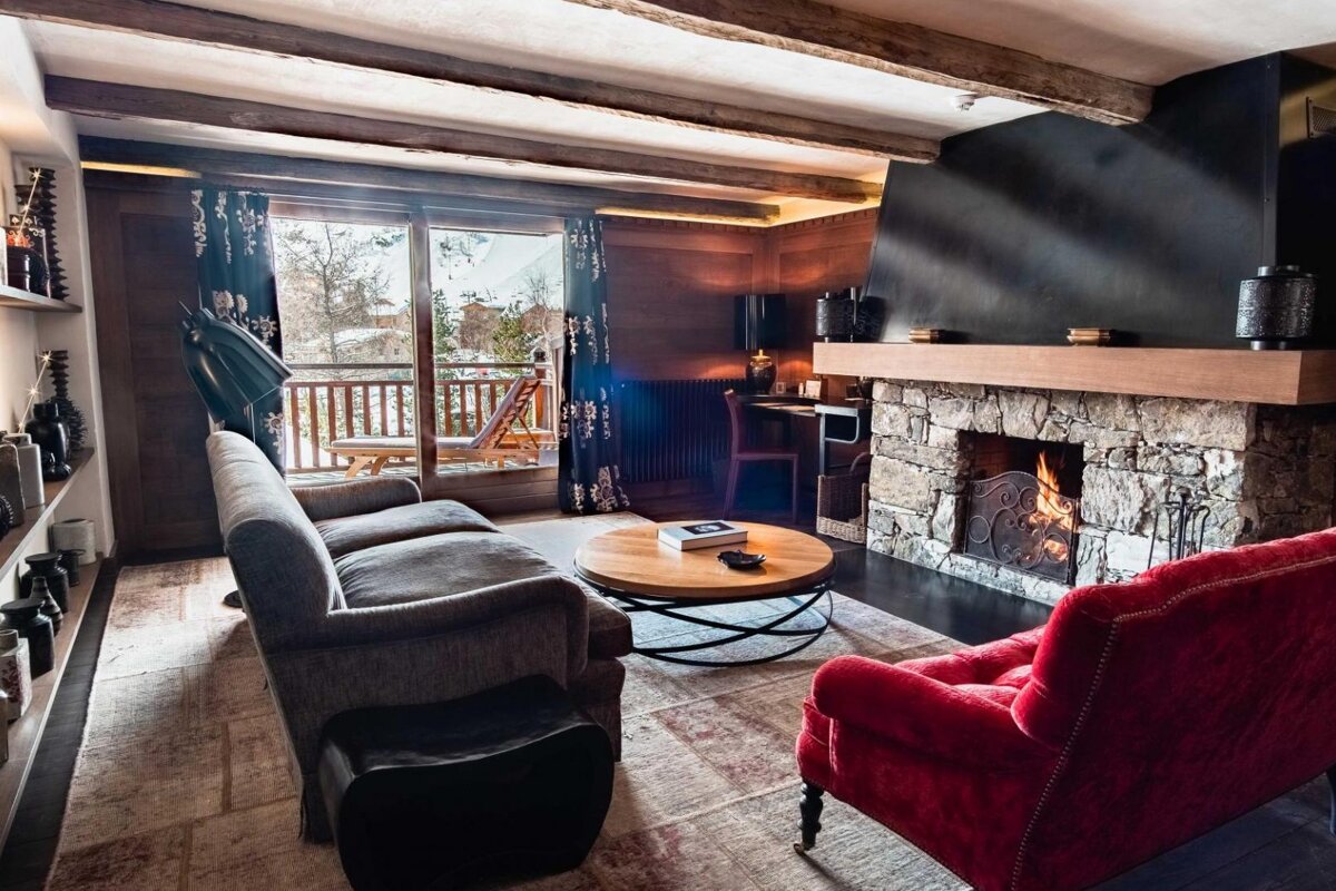 A living room with a fireplace and a couch