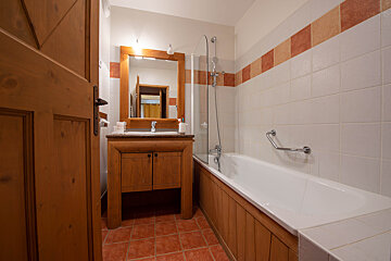 A bathroom with a bathtub and a sink