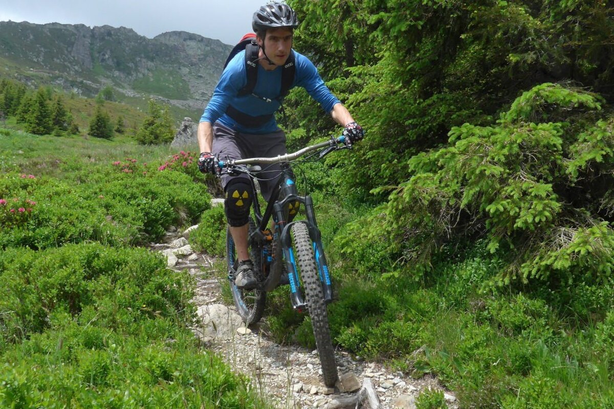 a mountain biker on a trail in chamonix