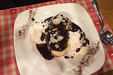 a square plate of profiteroles