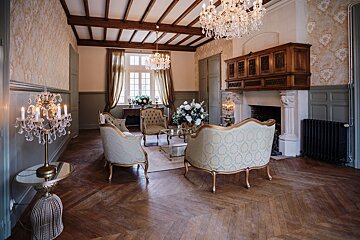 A living room filled with furniture and a chandelier
