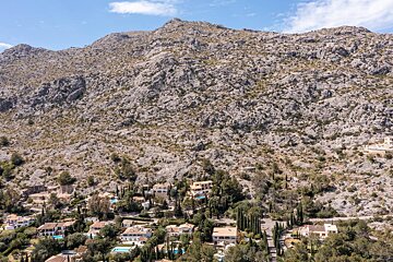 A mountain with a lot of houses on it
