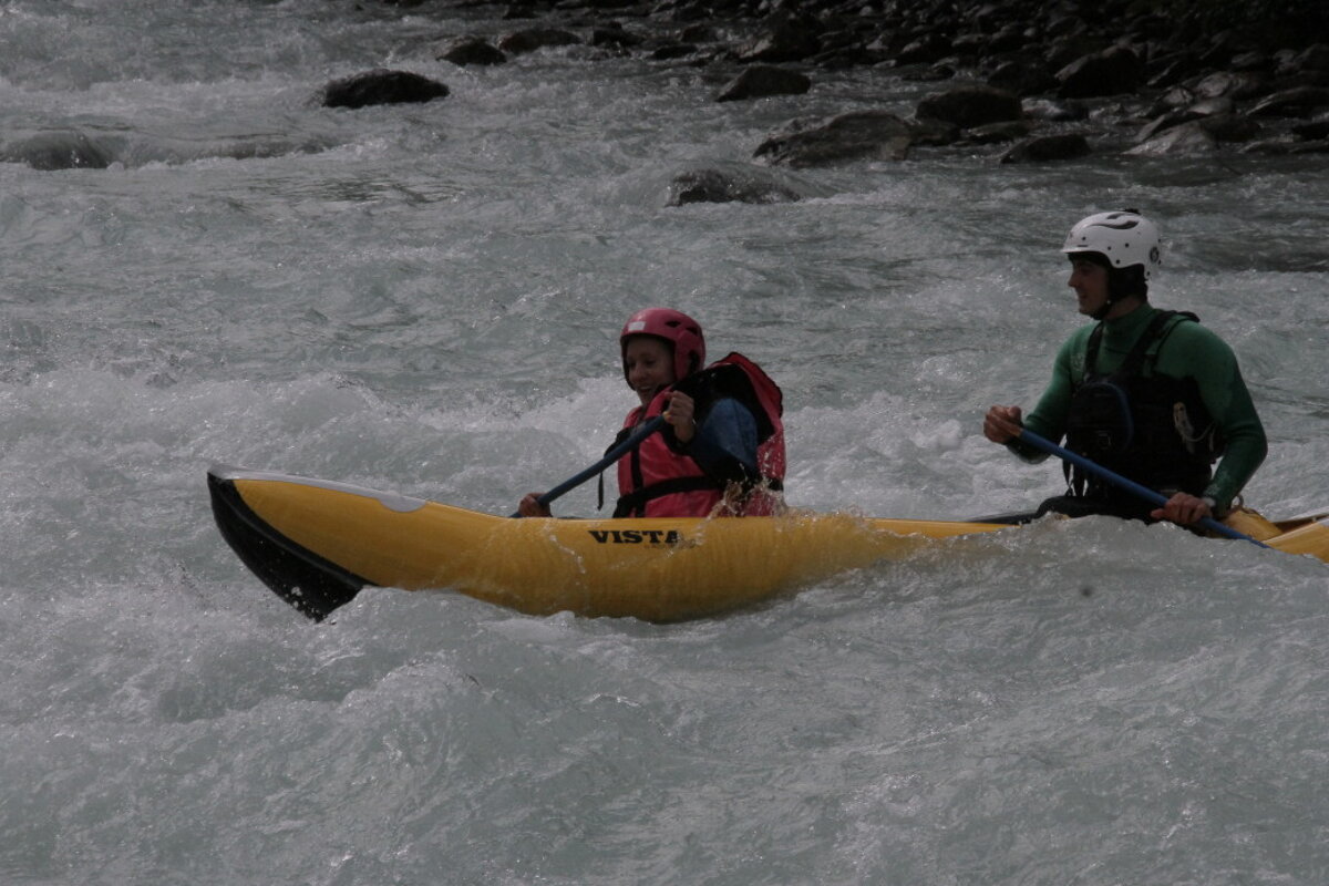 two person white water rafting