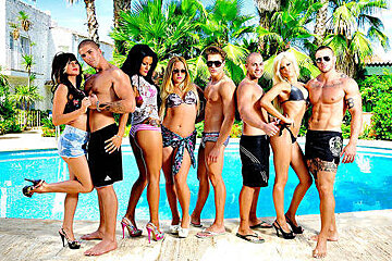 people in bikinis by a swimming pool