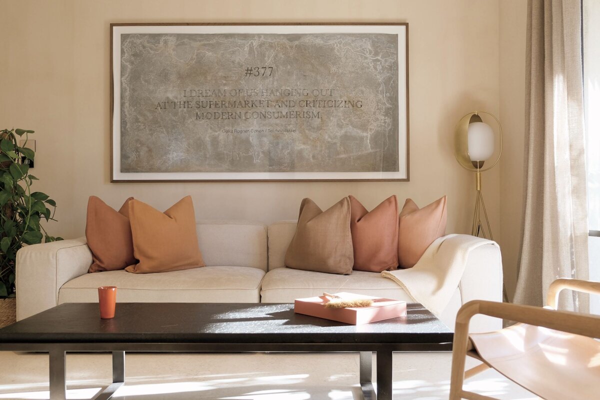 A living room with a couch and a poster that says # 377